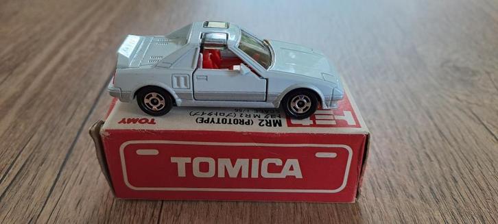 Tomica Toyota MR2 (prototype) schaal 1/56, Hobby en Vrije tijd, Modelauto's | Overige schalen, Zo goed als nieuw, Auto, Verzenden