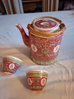 Chinese theepot en kopjes in rieten mand, Ophalen