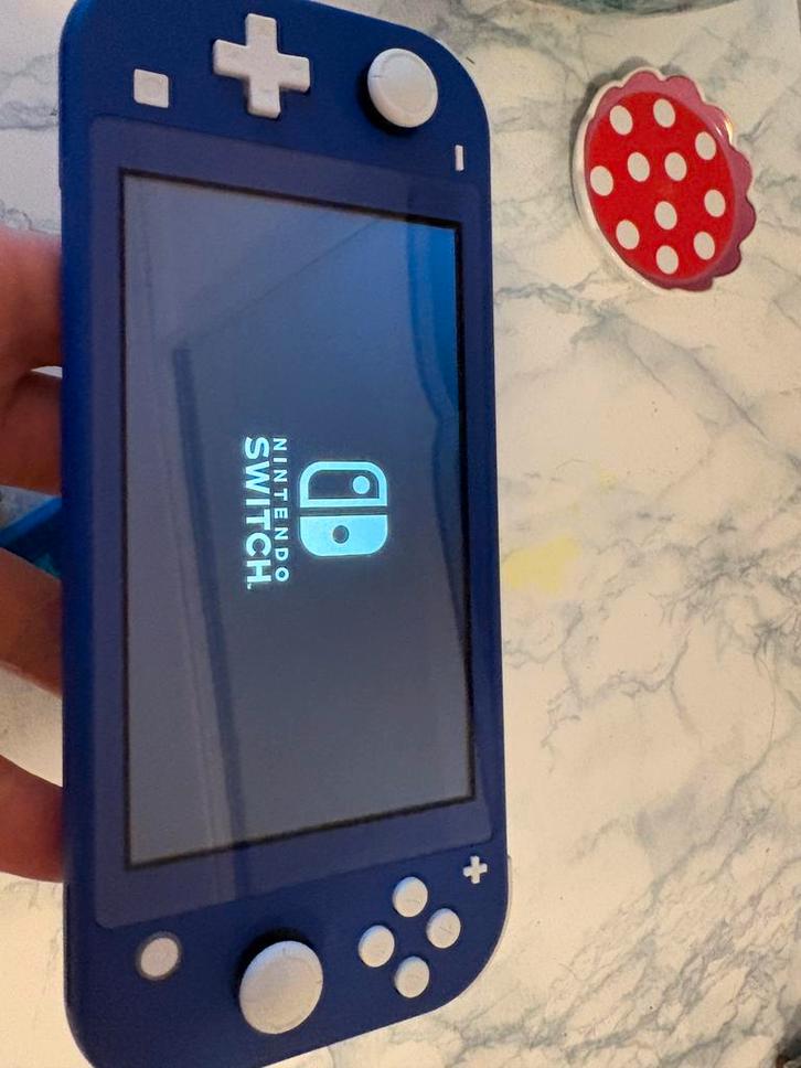 Nintendo Switch lite blauw., Spelcomputers en Games, Spelcomputers | Nintendo Switch Lite, Zo goed als nieuw, Verzenden