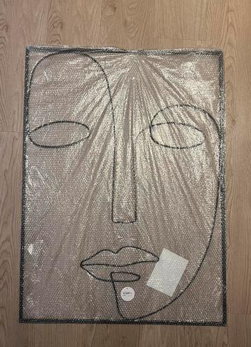 Zwarte metalen wanddecoratie gezicht beschikbaar voor biedingen