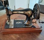 Antieke Singer naaimachine, Ophalen