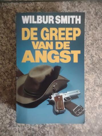 Wilbur Smith - De greep van de angst.  Uitgave 1990 beschikbaar voor biedingen