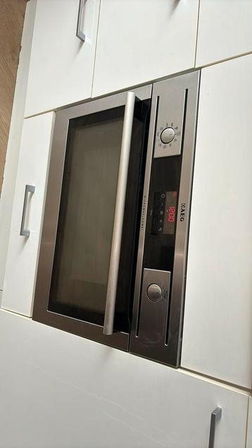 Goedwerkend AEG  combi inbouwoven beschikbaar voor biedingen