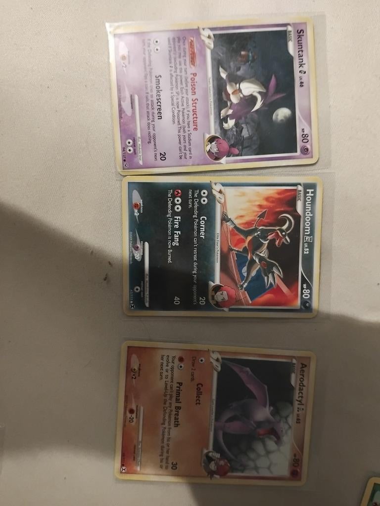 Pokémon Kaarten sp: Skuntank, Houndoom, Aerodactyl, Ophalen of Verzenden, Gebruikt, Meerdere kaarten