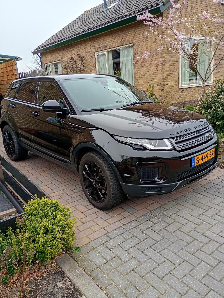 Land Rover Range Rover Evoque 2.0 SI4 4WD AUT 2016 Zwart, Auto's, 1800 kg, Zwart, 4 cilinders, Leder en Stof