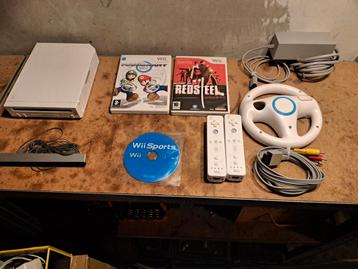 Nintendo wii met 2 wii motion controllers en 3 topspellen  beschikbaar voor biedingen