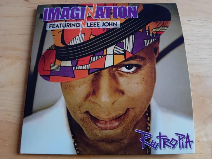 CD Imagination ft. Leee John - Retropia + 4 extra tracks, Cd's en Dvd's, Cd's | Pop, Zo goed als nieuw, 2000 tot heden, Verzenden