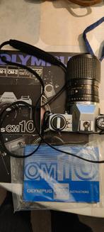 Olympus om10 met boekjes, Audio, Tv en Foto, Fotocamera's Analoog, Ophalen of Verzenden, Gebruikt, Spiegelreflex, Olympus