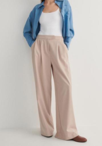 Beige wijde pijpen pantalon  van Reserved maat 40 beschikbaar voor biedingen