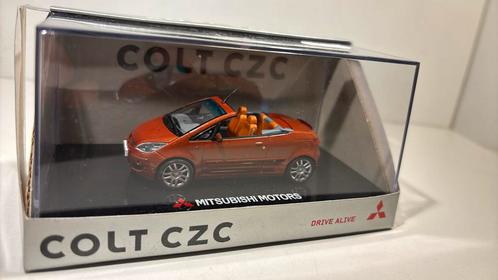Mitsubishi colt czc Oranje sun star 1.43, Hobby en Vrije tijd, Modelauto's | 1:43, Zo goed als nieuw, Auto, Universal Hobbies