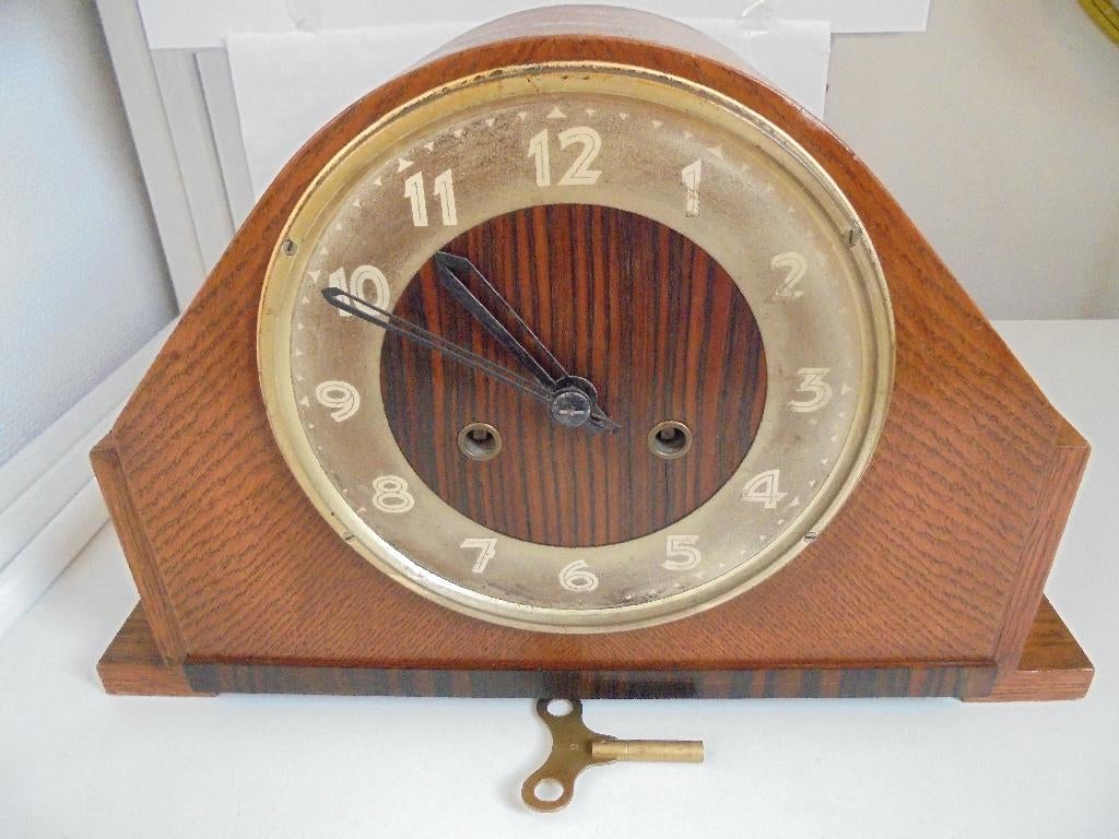 Pendule klok schoorsteenmantel, Ophalen