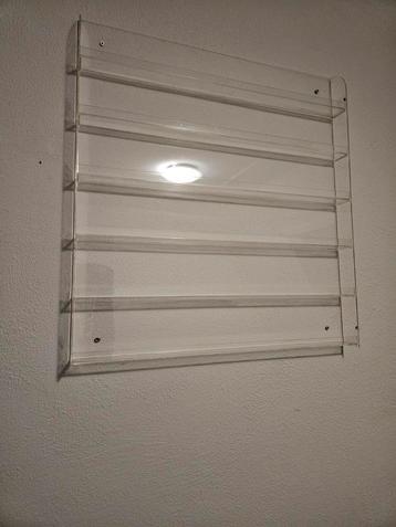 Transparant nagellak opbergsysteem voor aan de muur. beschikbaar voor biedingen