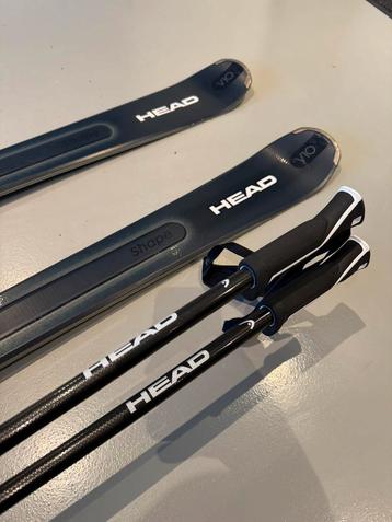 Head Shape e-V10 Skis + PR 11 GW Bindings met stokken 
