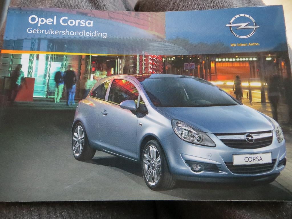 Instructieboek Opel Corsa 2010 + handleiding audio/navigatie, Ophalen of Verzenden