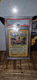 Jolteon Jungle 4/64 PSA 7 NO SYMBOL ERROR, Ophalen of Verzenden, Zo goed als nieuw, Losse kaart