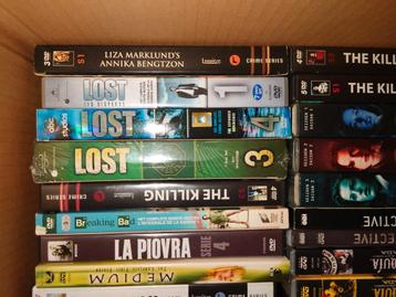 Een doos vol dvd series beschikbaar voor biedingen