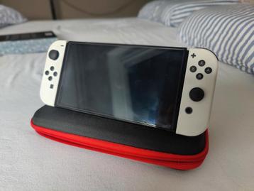 Nintendo Switch Oled met dockingstation, koffer etc beschikbaar voor biedingen