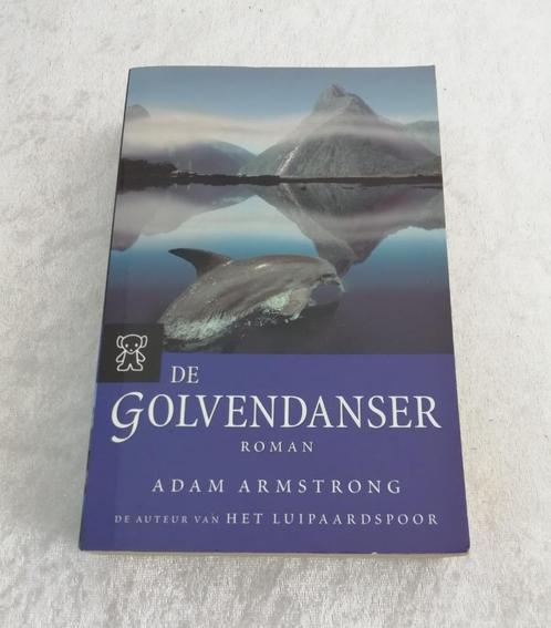 De golvendanser. Adam Armstrong.  Uit: 2005, Boeken, Romans, Zo goed als nieuw, Ophalen of Verzenden