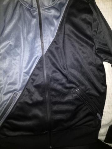 Grijs/zwart vest van de Coolcat.   beschikbaar voor biedingen