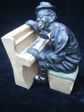 Beeld/boekensteun pianist beschikbaar voor biedingen