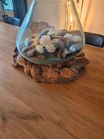 Drijfhout vaas, Ophalen