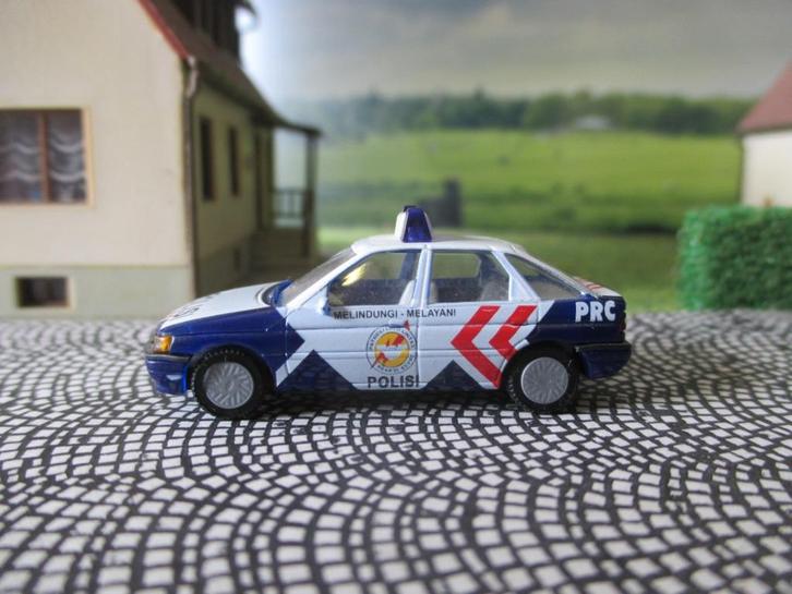 Ford Escort Mk.5 - Praliné POLISI Politie Indonesië, Hobby en Vrije tijd, Modelauto's | 1:87, Zo goed als nieuw, Auto, Rietze