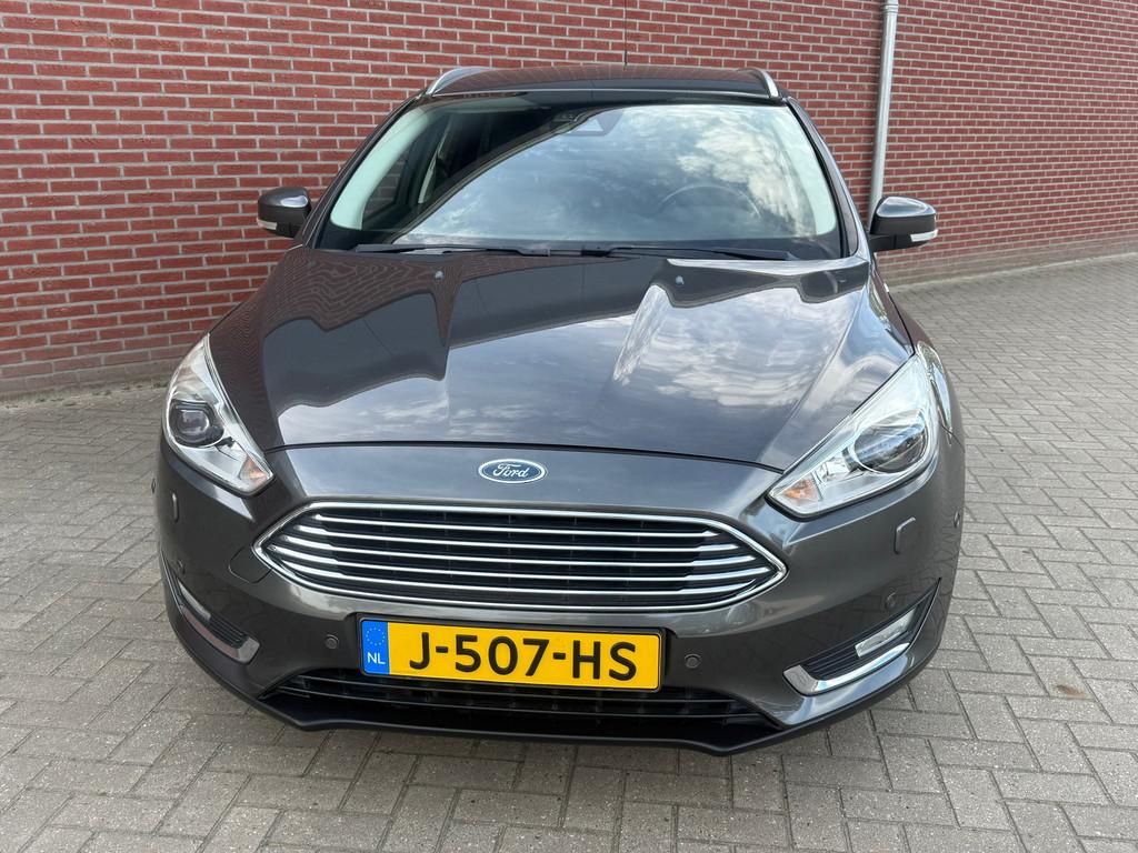 Ford Focus Wagon 1.0 Titanium Edition / Airco / Cruise / PDC, 125 pk, Gebruikt, Euro 6, Leder en Stof