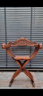 schaarstoel of Dante-stoel., Ophalen