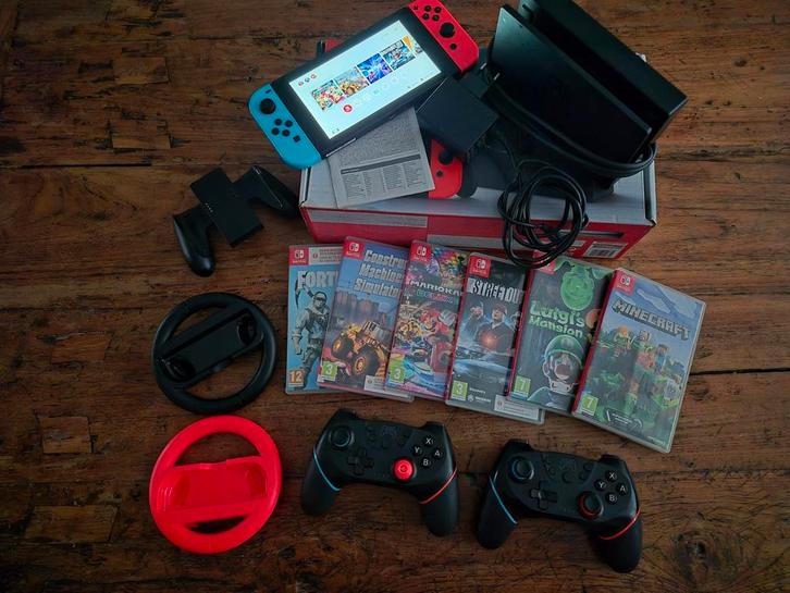 Nintendo Switch met games en accessoires, Spelcomputers en Games, Games | Nintendo Switch, Gebruikt, Avontuur en Actie, 3 spelers of meer