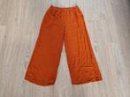 Een roest kleurige broek met wijde pijpen maat 42, Kleding | Dames, Ophalen of Verzenden, Zo goed als nieuw, Maat 42/44 (L), Lang