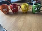 M&M mokken, Huis en Inrichting, Keuken | Servies, Keramiek, Ophalen of Verzenden, Zo goed als nieuw, Overige stijlen