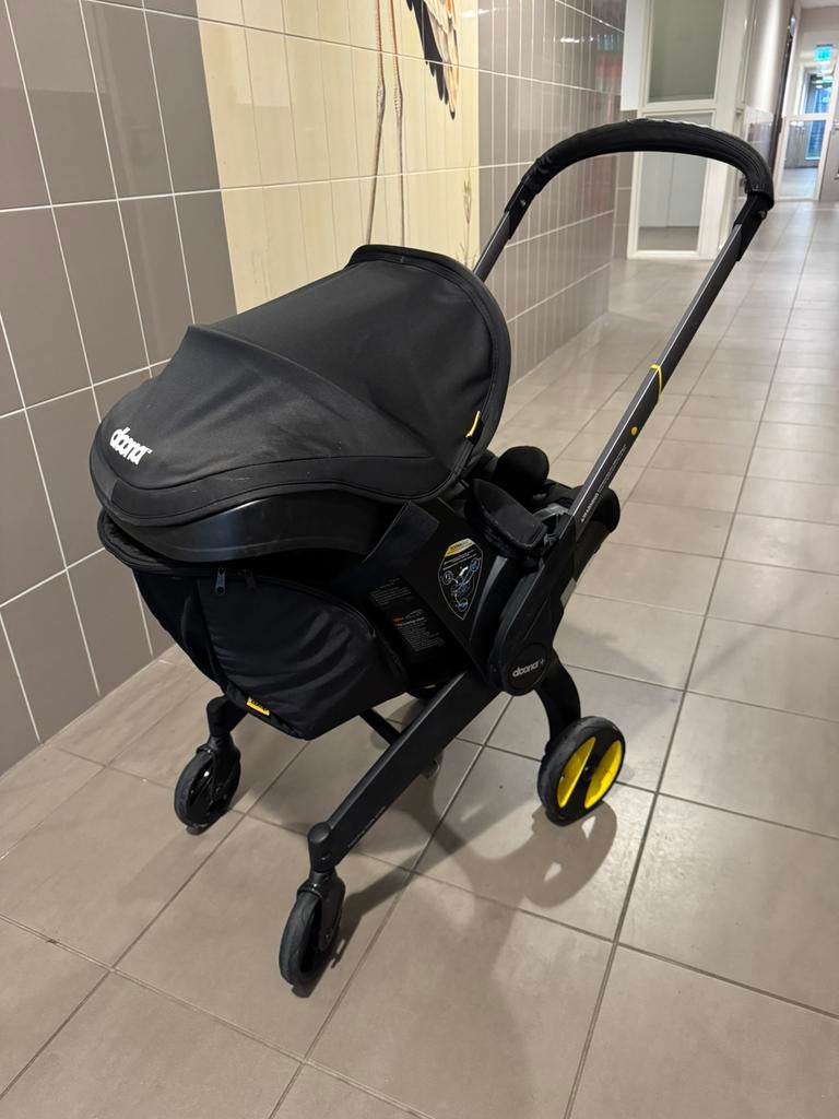 Doona 2 in 1 Autostoel en Kinderwagen, Ophalen of Verzenden, Gebruikt