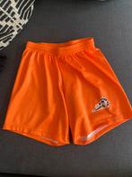 VVC oranje wedstrijdbroekje maat 10 - 140, Ophalen of Verzenden, Zo goed als nieuw, Overige maten, Oranje