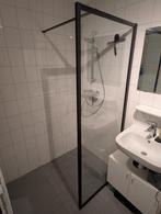 Zwarte glazen douchewand, Ophalen