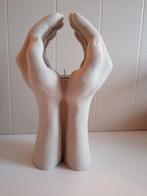 Waxinelichthouder handen van gips, Ophalen