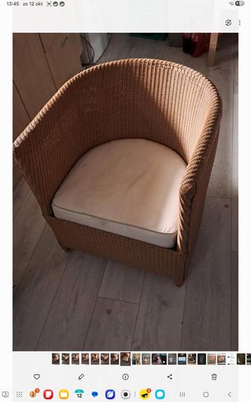 Rotan fauteuil met kussen beschikbaar voor biedingen
