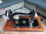 Antieke naaimachine Gritzner, Ophalen