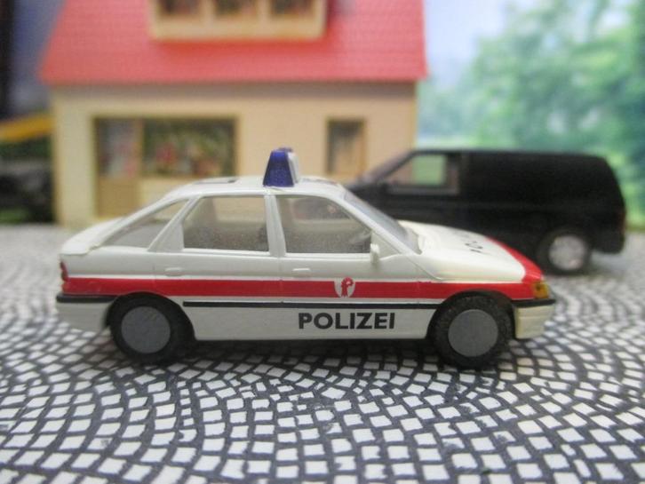 Ford Escort Mk.5 - Praliné Polizei / Politie Zwitserland, Hobby en Vrije tijd, Modelauto's | 1:87, Zo goed als nieuw, Auto, Rietze