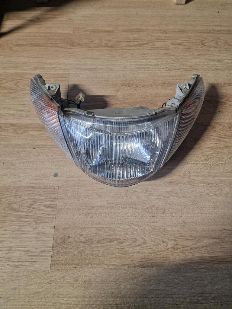 Suzuki AN400 Burgman 2001-2002 koplamp, Van Kleef Motoren, Gebruikt, Dorsvloerweg 419, 2661MN Bergschenhoek, Ophalen of Verzenden
