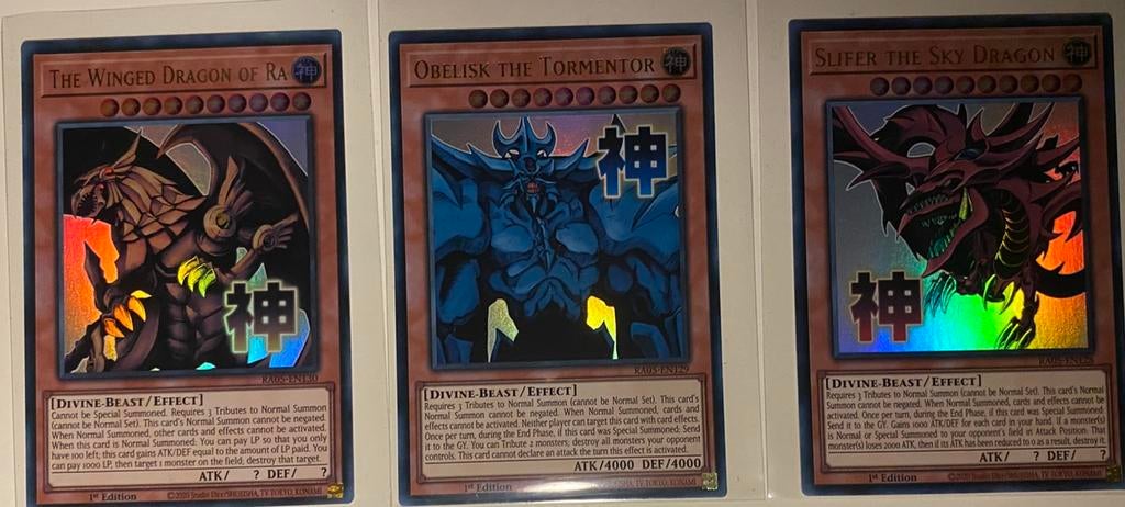 Yu-Gi-Oh! Stamped Egyptian God Set RA05 1st Edition English, Hobby en Vrije tijd, Verzamelkaartspellen | Yu-gi-Oh!, Ophalen of Verzenden