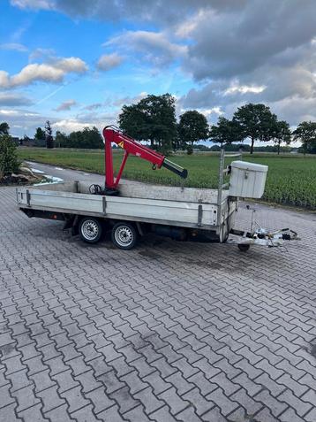 Tandemasser met hydraulische kraan beschikbaar voor biedingen
