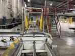 Palletwikkelaar met transportlijn, Ophalen