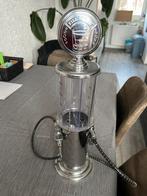 Benzinepomp (sterke drank etc)., Ophalen