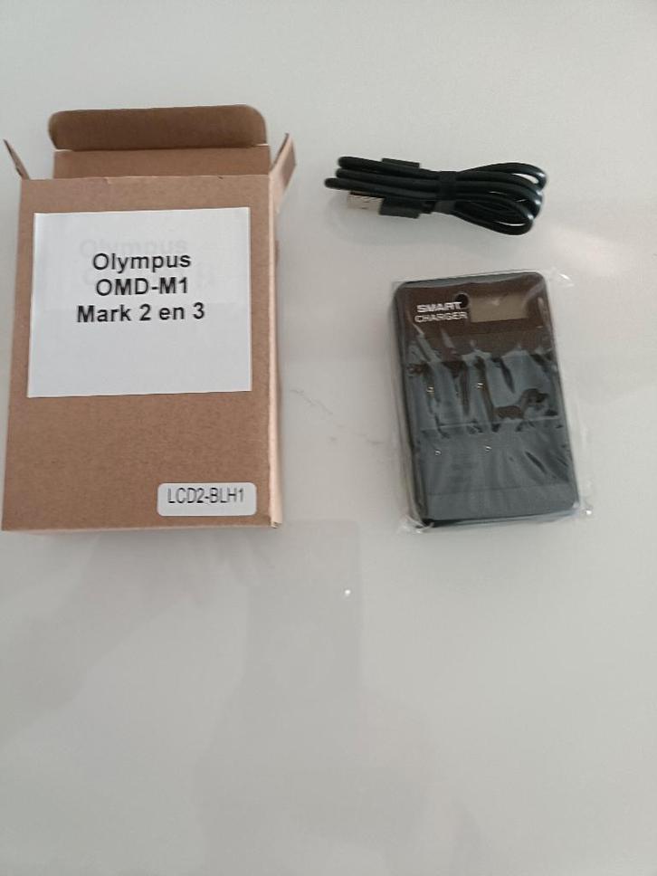 Olympus camera oplader + accu  BLH-1, Audio, Tv en Foto, Accu's en Batterijen, Nieuw, Oplaadbaar, Ophalen of Verzenden