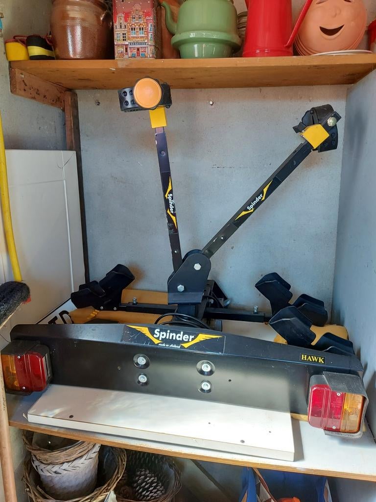 Spinder fietsendrager, Ophalen