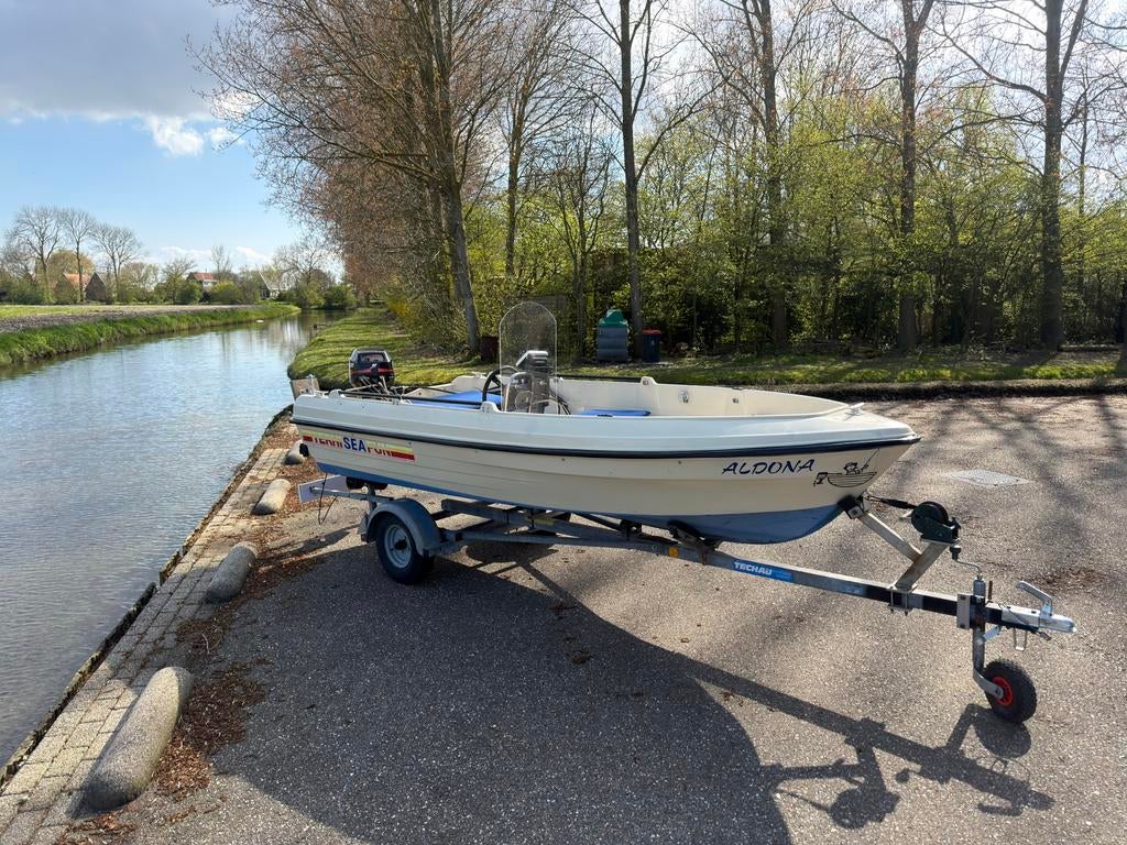 Terhi sea fun 9.9 mecury met trailer, Ophalen, Zo goed als nieuw, 3 tot 6 meter, Buitenboordmotor