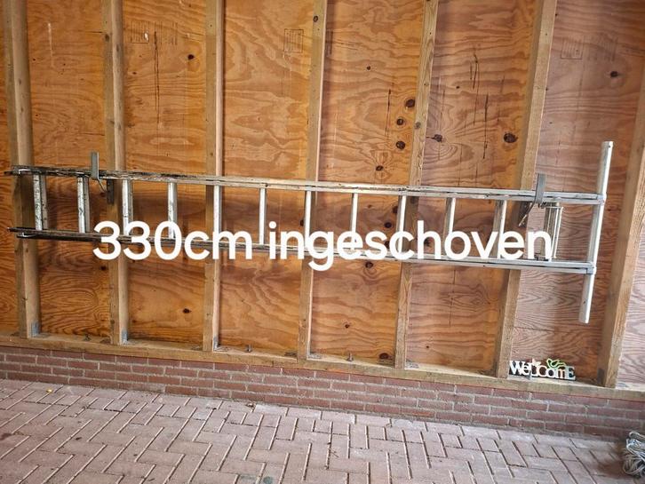 Uitschuifbare ladder, Doe-het-zelf en Verbouw, Ladders en Trappen, Gebruikt, Ladder, 4 meter of meer, Opvouwbaar of Inschuifbaar