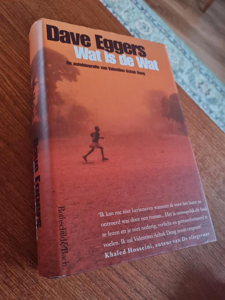 Dave Eggers - Wat is de wat, Boeken, Literatuur, Zo goed als nieuw, Amerika, Ophalen of Verzenden