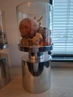 Twee grote windlichten, Ophalen