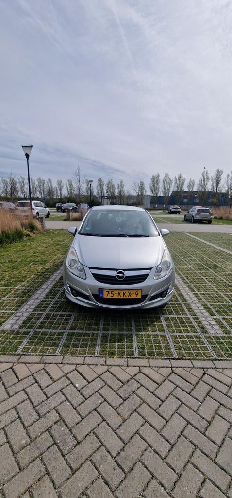 Opel Corsa 1.4 16V 5D 2010 Grijs, Auto's, Opel, Voorwielaandrijving, 1063 kg, 4 cilinders, 49 €/maand